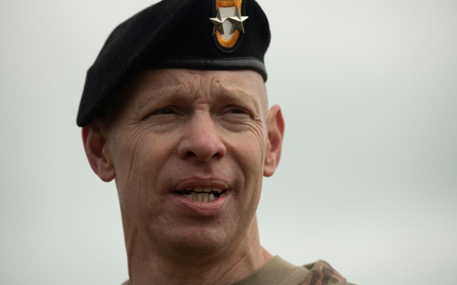 Commander of the 101st Airborne Division Maj. Gen. Brett Sylvia watches his troops conduct an air assault demonstration in Normandy, France, on June 2, 2024.