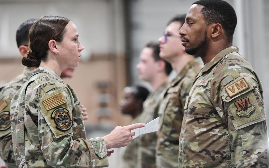 An Air Force officer inspects at airmen in Nebraska.