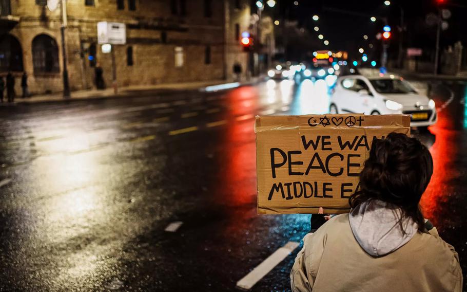 Protesters hold up signs for hostages in Gaza and cause traffic congestion in Jerusalem on Wednesday, Jan. 24, 2024, during a march organized by women’s groups meant to raise awareness about the plight of female hostages still in Gaza. 