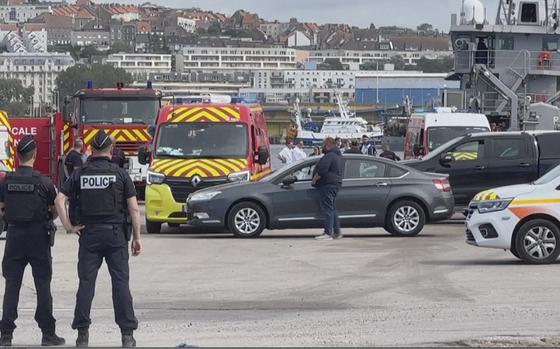 In this grab taken from video provided by BFM Littoral, emergency services at the port of Boulogne-Sur-Mer, France, Tuesday, Sept. 3, 2024, after a boat thought to be carrying migrants ripped apart attempting to cross the English Channel. (BFM Littoral via AP)