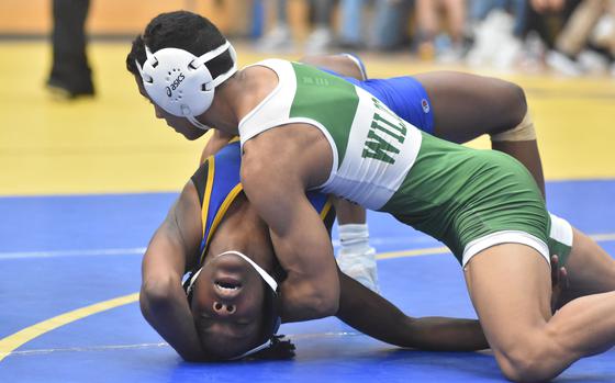 Sigonella's Rickalia Goss tries to escape from Naples' Joaquin Villescas in a 120-pound match at the DODEA European Wrestling Championships in Wiesbaden, Germany on Friday, Feb. 9, 2024.

Kent Harris/Stars and Stripes