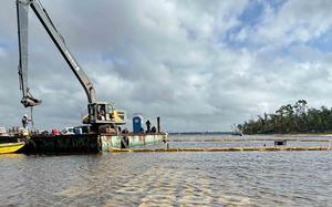 Air Force officials install a new artificial reef on the shores of Tyndall Air Force Base, Fla., on Oct. 30, 2024. A Rutgers University team of oyster researchers is working with the Defense Advanced Research Projects Agency on the reef, which is designed to protect the base from hurricanes and flooding.