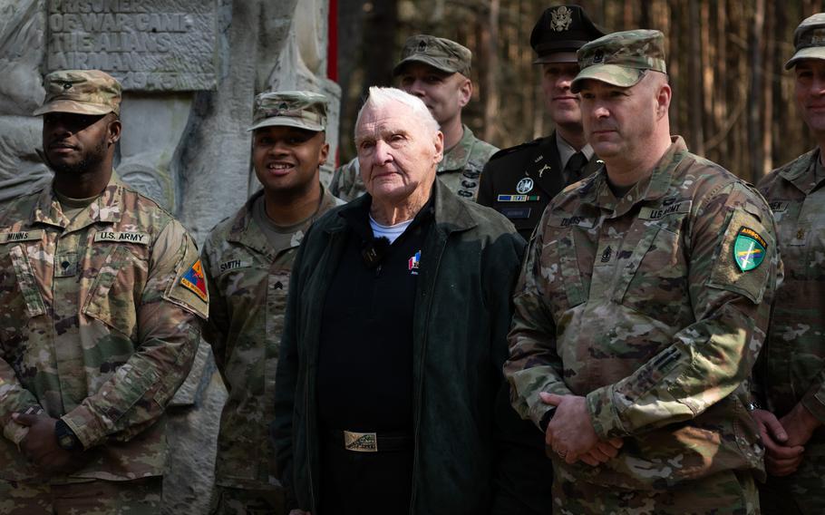 Lester Schrenk is flanked by U.S. soldiers.