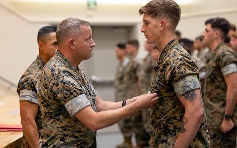 Marine Corps Cpl. Austin Potter is awarded the Navy and Marine Corps Achievement Medal at Camp Schwab, Okinawa, Oct. 10, 2024. 