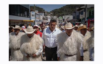Mexican Senate candidate Willy Ochoa walks with fellow Institutional Revolutionary Party candidates before a rally in San Juan Chamula, Mexico.