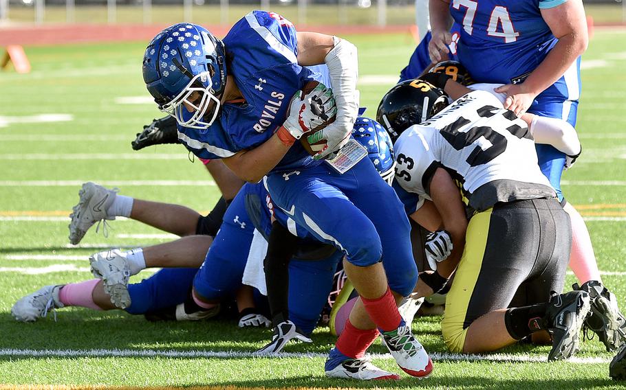 Running back Landon Torroll powers ahead for a 1-yard touchdown during the fourth quarter of the Royals' Division I semifinal matchup with Stuttgart on Oct. 21, 2023, at Ramstein High School on Ramstein Air Base, Germany.