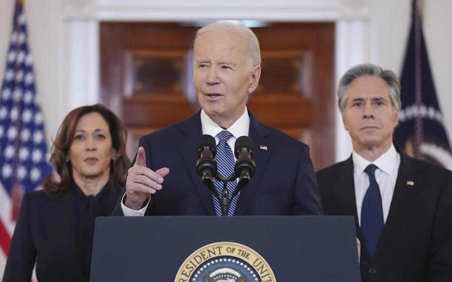 President Joe Biden, center, with Vice President Kamala Harris, left, and Sec. of State Anthony Blinken, right, speaks