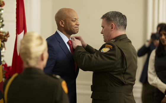 Governor Wes Moore officially receives the Bronze Star Medal in a ceremony at the Governors Mansion in Annapolis, Maryland on Friday, Dec. 20, 2024.  (Marvin Joseph/The Washington Post via AP)