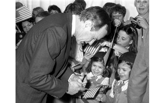 West Berlin, West Germany, Feb. 1, 1983: Vice President George Bush signs autographs for a delighted crowd at the U.S. Command Berlin Sports Center. Bush had just made his first visit to the Berlin Wall, and called it "one of the cruelest existing realities of our time." He added that having seen the infamous barrier, "I'll never again take freedom for granted." Six years later, during his presidency, the wall finally came down.

Read the full article here.
https://www.stripes.com/migration/from-the-s-s-archives-bush-greets-gis-families-in-berlin-1.65822

Looking for Stars and Stripes’ historic coverage? Subscribe to Stars and Stripes’ historic newspaper archive! We have digitized our 1948-1999 European and Pacific editions, as well as several of our WWII editions and made them available online through https://starsandstripes.newspaperarchive.com/

META TAGS: Cold War; Berlin Wall; George Herbert Walker Bush; George H.W. Bush; president; vice-president; 