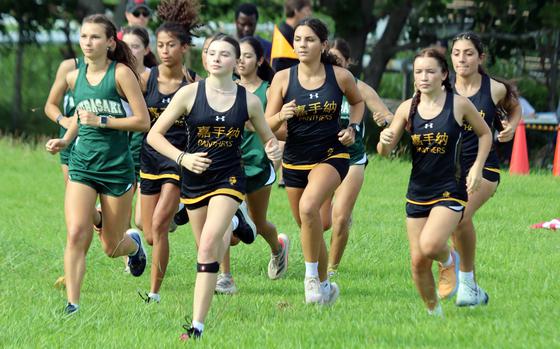 Kadena's Allie Sims grabs the early lead at the start of Saturday's Okinawa girls cross-country race at Cape Zampa. Sims won with a time of 23 minutes, 0.16 seconds.