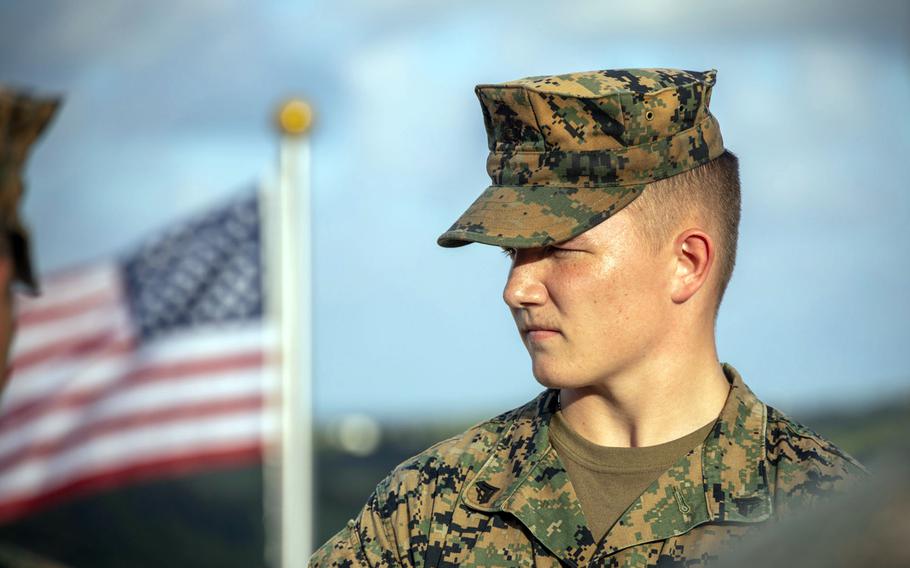 Cpl. Tyler Clinard, an intelligence analyst with 12th Marine Littoral Regiment, is promoted during the Resolute Dragon exercsie at Camp Ishigaki, Okinawa, Aug. 1, 2024. He is the second Marine ever to be promoted into the non-commissioned officer ranks on Ishigaki.