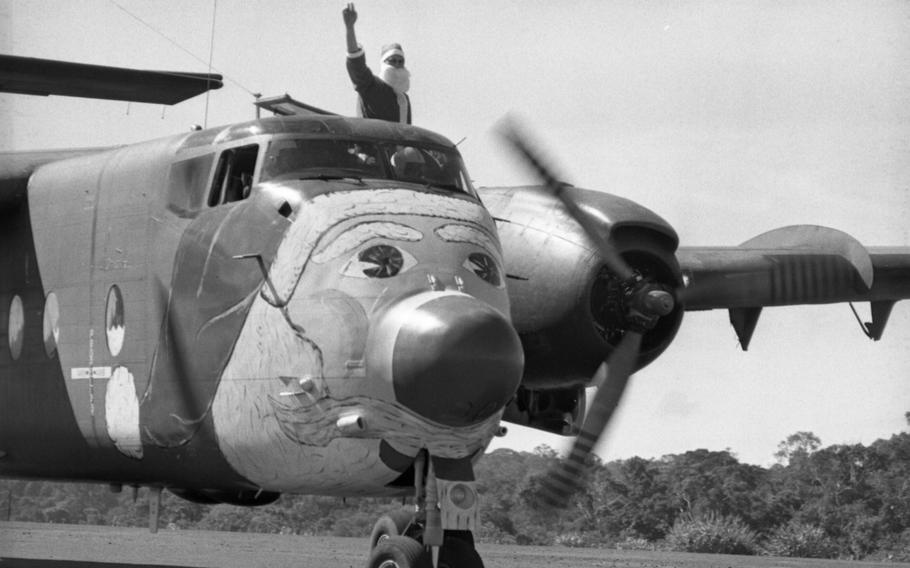 Santa Claus waves from the cockpit as his “sled” lands at Nhon Cho, home of Detachment 35, “B” Company, 5th Special Forces Group, 80 miles northeast of Saigon.