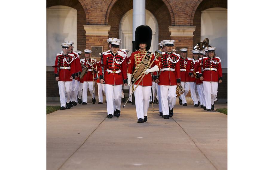 Marines with “The President’s Own” U.S. Marine Band march down Center Walk during a Friday Evening Parade