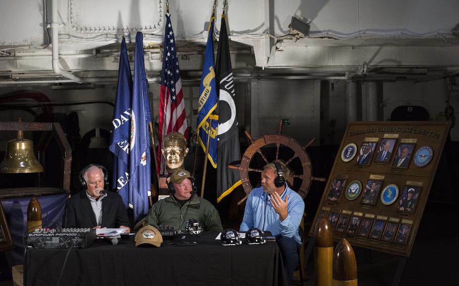 Host of the Ricky Rahne Coach’s Show with Capt. Christopher Hill, CO of the aircraft carrier Eisenhower and Ricky Rahne, head football coach at Old Dominion University during a broadcast of the show on WVSP-FM