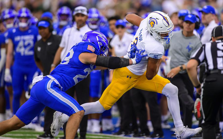 Air Force defensive back Lincoln Tuioti-Mariner pushes San Jose State receiver Nick Nash out of bounds