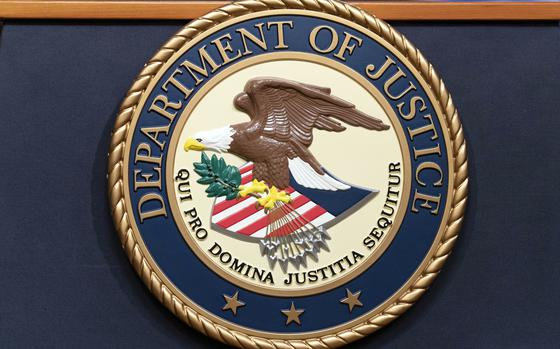 FILE - The Department of Justice seals is seen during a news conference at the DOJ office in Washington, May 16, 2023. (AP Photo/Jose Luis Magana, File)