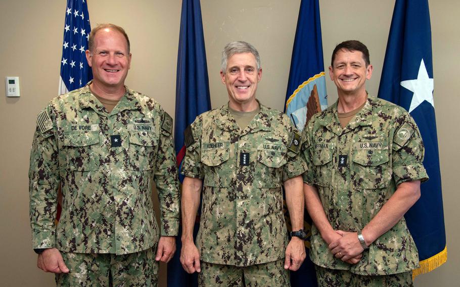 Rear Adm. Greg Huffman, outgoing commander of Joint Region Marianas, right, and Rear Adm. Brent DeVore, incoming commander, left, pose with Adm. Stephen Koehler, commander of U.S. Pacific Fleet, in Guam on May 25, 2024.