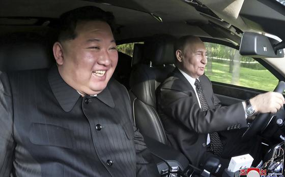 In this photo provided by the North Korean government, Russia's President Vladimir Putin, right, drives a car with North Korean leader Kim Jong Un sitting in front passenger seat at a garden of the Kumsusan State Guest House in Pyongyang, North Korea Wednesday, June 19, 2024. Independent journalists were not given access to cover the event depicted in this image distributed by the North Korean government. The content of this image is as provided and cannot be independently verified. Korean language watermark on image as provided by source reads: "KCNA" which is the abbreviation for Korean Central News Agency. (Korean Central News Agency/Korea News Service via AP)