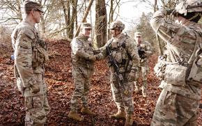 Sgt. Maj. of the Army Michael Weimer shakes hands with Col. Joshua Glonek.