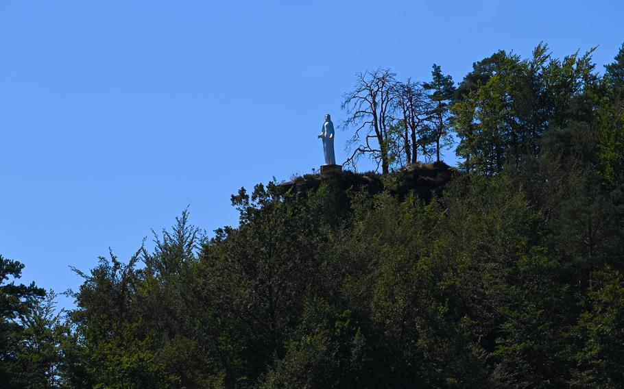 The White Madonna statue stands atop a hill near Fischbach-bei-Dahn, Germany, symbolizing peace. The statue was erected in 1959 as a World War II memorial and an anti-war symbol.