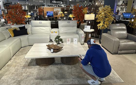A shopper pauses at a display in a furniture store Sunday, June 2, 2024, in Englewood, Colo. On Wednesday, June 12, 2024, the Labor Department issues its report on prices at the consumer level in May. 