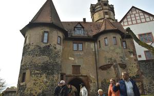 Visitors walk through one of the outer gatehouses of Ronneburg castle in Germany on Oct. 20, 2024.  About an hour drive from Wiesbaden, Ronneburg is one of only a few castles in Germany that retain their original 16th-century design.  