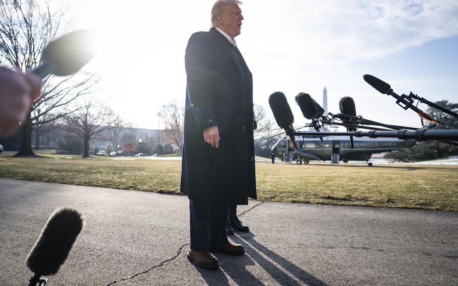 President Donald Trump speaks to reporters as he departs the White House on Friday. 