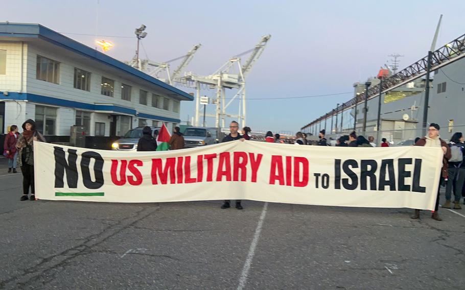 Dozens of activists in support of the Palestinian people set up a picket line at berth 21 in the Port of Oakland in front of the a US military transport ship, the MV Cape Orlando. 