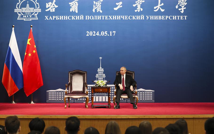 Russian President Vladimir Putin talks with students of the Harbin Institute of Technology in Harbin, China’s Heilongjiang Province, on Friday, May 17, 2024. 