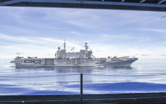 The Italian carrier ITS Cavour sails alongside the USS Abraham Lincoln somewhere in the Pacific Ocean, Aug. 9, 2024. 