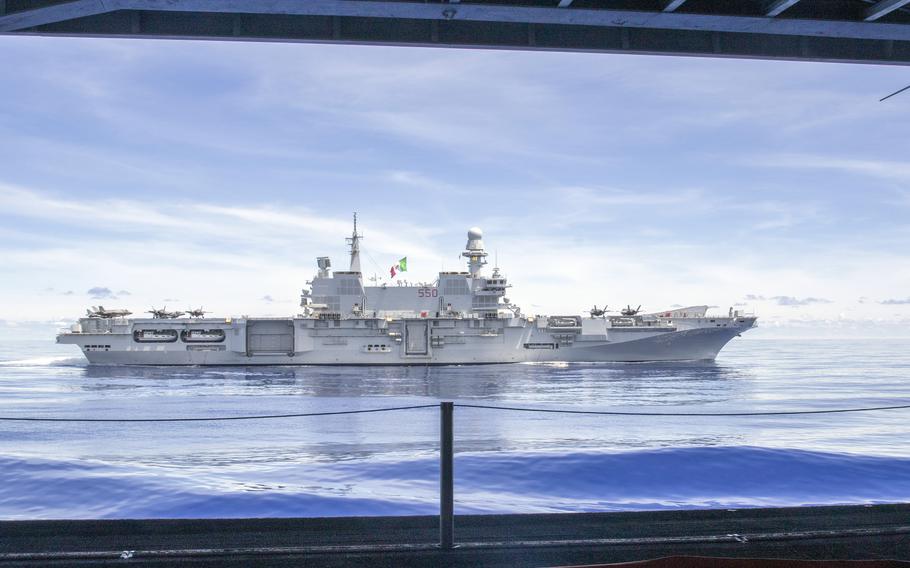 The Italian carrier ITS Cavour sails alongside the USS Abraham Lincoln somewhere in the Pacific Ocean, Aug. 9, 2024. 