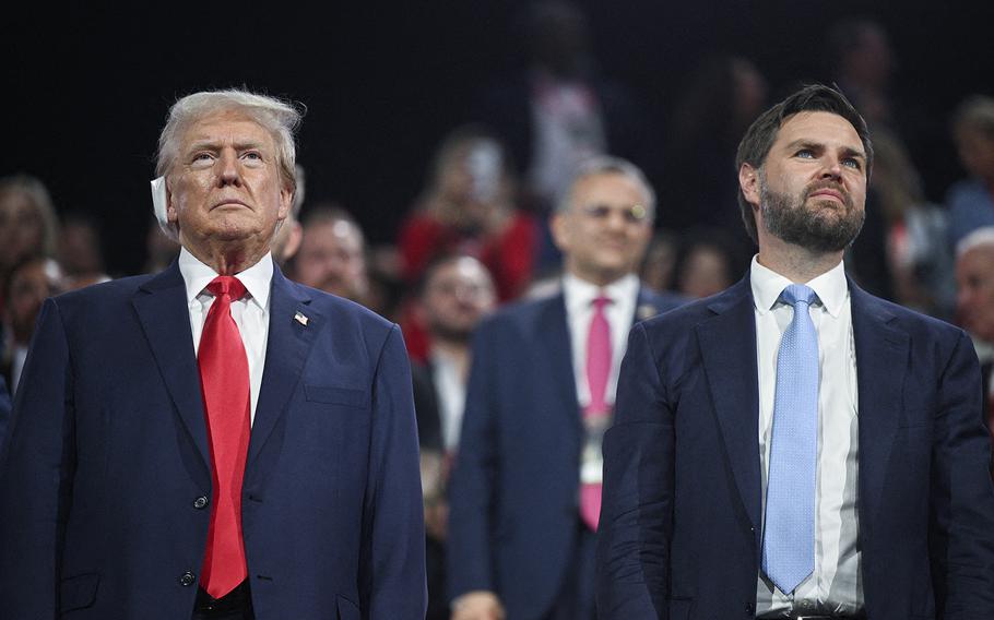 Former President and 2024 Republican presidential candidate Donald Trump, left, stands with U.S. Senator from Ohio and 2024 Republican vice president candidate J. D. Vance during the first day of the 2024 Republican National Convention at the Fiserv Forum in Milwaukee, July 15, 2024. 