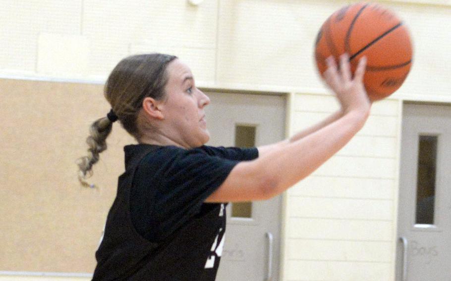 Jenna Cook practices in basketball.