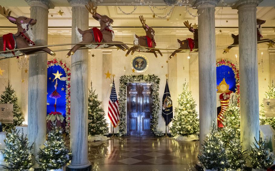 Santa’s sleigh and reindeer are suspended in Cross Hall with the help of special scaffolding built by White House carpenters. 