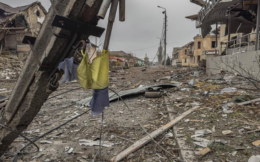 A central street covered in debris from destroyed residential buildings after Russian bombing in Kurakhove, Donetsk region.