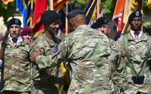 Maj. Gen. Andrew Gainey receives the colors of U.S. Army Southern European Task Force, Africa during a change of command ceremony at Caserma Ederle, Italy, July 18, 2024.