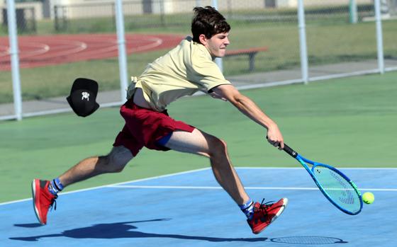 Matthew C. Perry's Joseph Steenhoven loses his cap as he chases down a backhand during Saturday's DODEA-Japan tennis matches. Steenhoven lost to Zama's Dayne Marble 8-5.