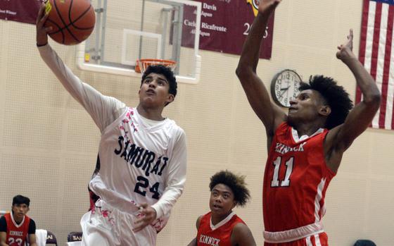 Matthew C. Perry's Eloy Nunez drives to the basket against Nile C. Kinnick's Isaiah Kimbrough.