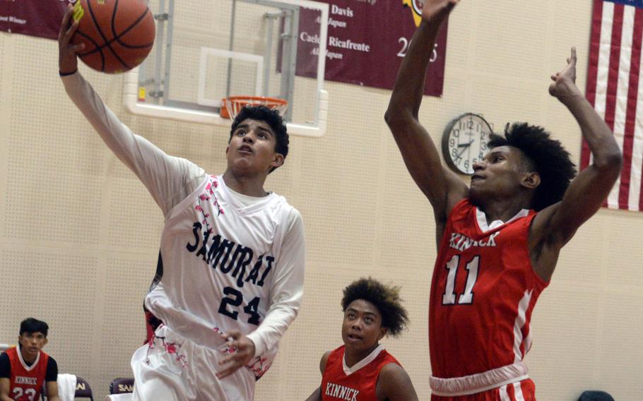 Eloy Nunez drives to the basket.