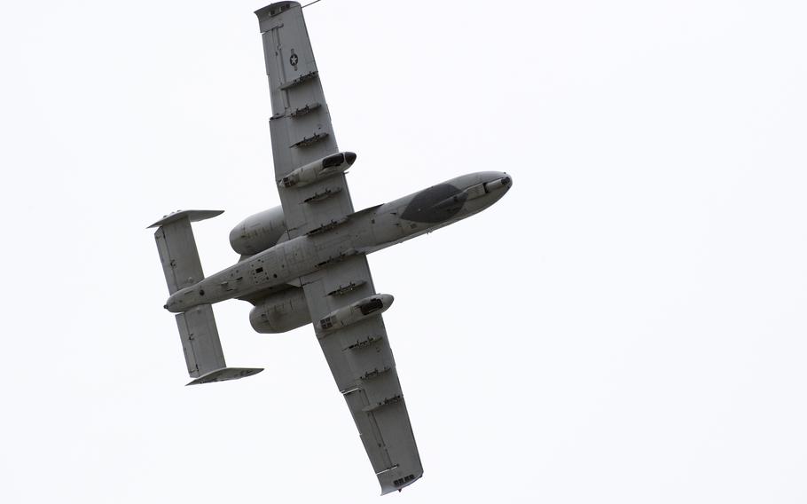 The underside of a plane flying.