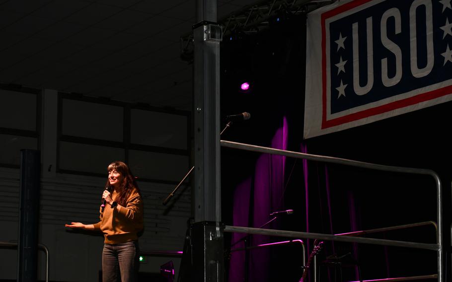 A comedian performs at USO show for military members and family in Italy.