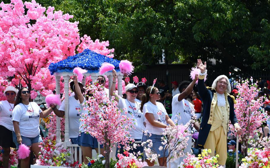 The National Cherry Blossom Festival’s float sports George Washington amongst faux cherry trees. The float was part of the nation’s capital’s Independence Day Parade.