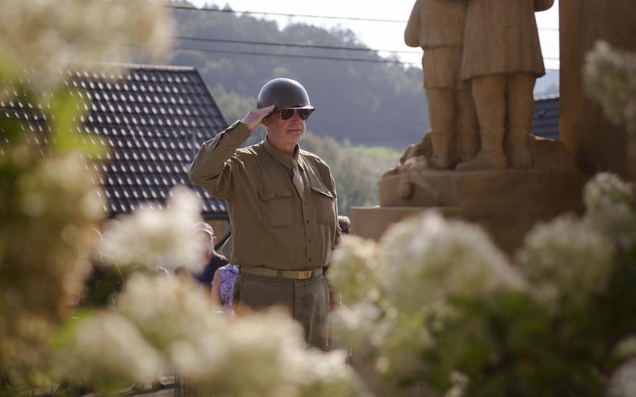 A Czech veteran salutes the grave site of a fallen American during the 80th commemoration of the Battle over the White Carpathians in Sanov, Czech Republic, on Sept. 1, 2024.