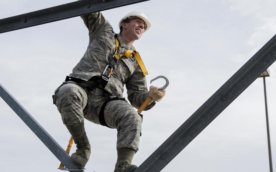 Airman 1st Class Joseph Miele climbs the radar tower at Sheppard Air Force Base, Texas, in 2017.  