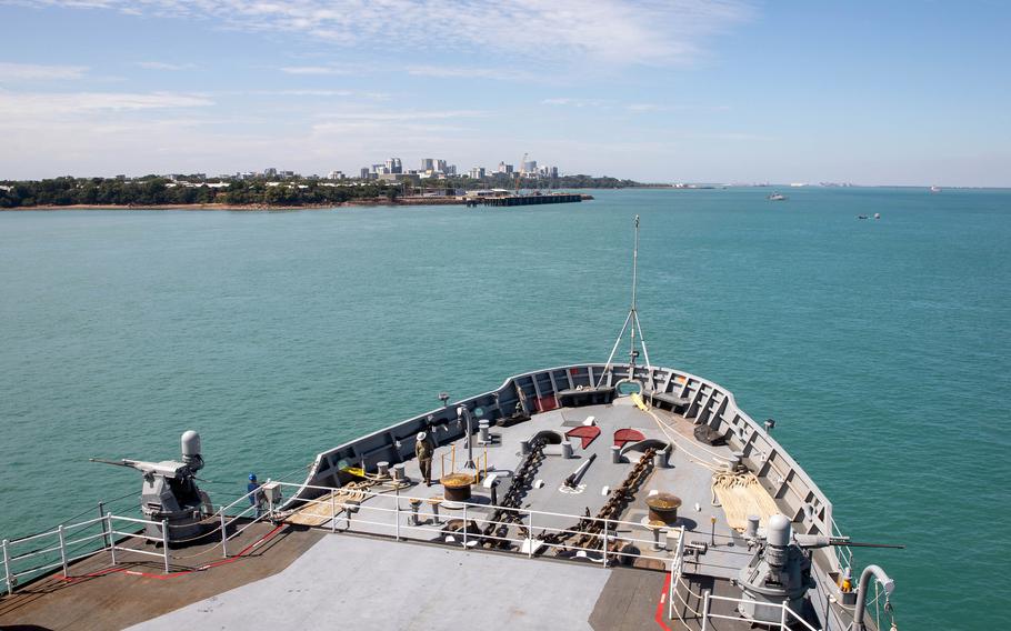 The submarine tender USS Emory S. Land prepares to pull into HMAS Coonawarra, a navy base in Darwin, Australia, on May 28, 2024. 