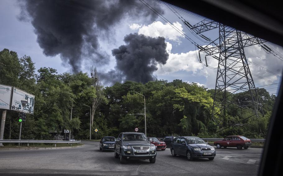 Black smoke rises in an industrial area in Zaporizhzhia after a Russian missile strike on July 7, 2023. 