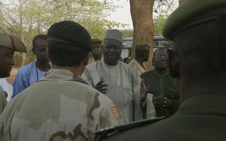 Mahamadou Zety Maiga, governor of the province of Tahoua, Niger, welcomes a Green Beret captain from Stuttgart, Germany, during a visit June 10, 2005 to medical training being given by U.S. troops to Nigerien soldiers in Tahoua, Niger. 