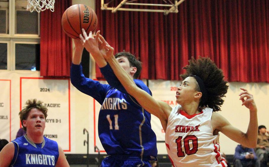 Tim Oue and Taishi Boyd battle for the ball.