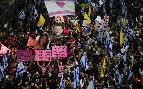 People protest against Prime Minister Benjamin Netanyahu's government and call for the release of hostages held in the Gaza Strip by the Hamas militant group, in Tel Aviv, Israel, Saturday, Sept. 7, 2024. (AP Photo/Ariel Schalit)