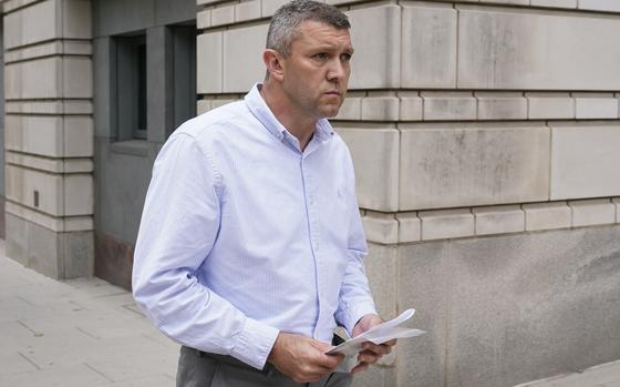 FILE - Washington Metropolitan Police Department Lt. Shane Lamond departs federal court after pleading not guilty to obstruction of justice and other charges, May 19, 2023, in Washington. A trial is underway for a police officer charged with leaking confidential information to Proud Boys leader Enrique Tarrio after the extremist group's members burned a stolen Black Lives Matter banner in the nation's capital. (AP Photo/Patrick Semansky, File)